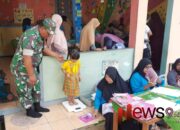 Dukung Kesehatan Balita, Babinsa Kertosari Dampingi Posyandu Harapan Jaya