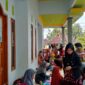 FOTO: Pelayanan kesehatan dasar masyarakat melalui kegiatan rutin Pos Pelayanan Terpadu (Posyandu). @by_News9.id